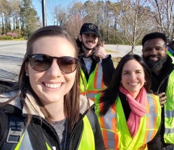 A group of engineers, local advocates, and SRTS professionals set out to assess the area during a School Road Safety Audit wearing safety vests.